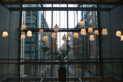 Low angle view of illuminated lights hanging on ceiling
