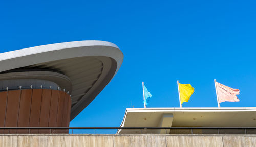 Low angle view of building against clear blue sky