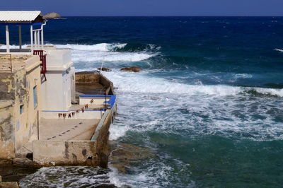 High angle view of built structure by sea