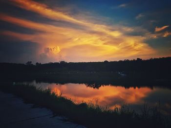 Scenic view of lake against sky during sunset