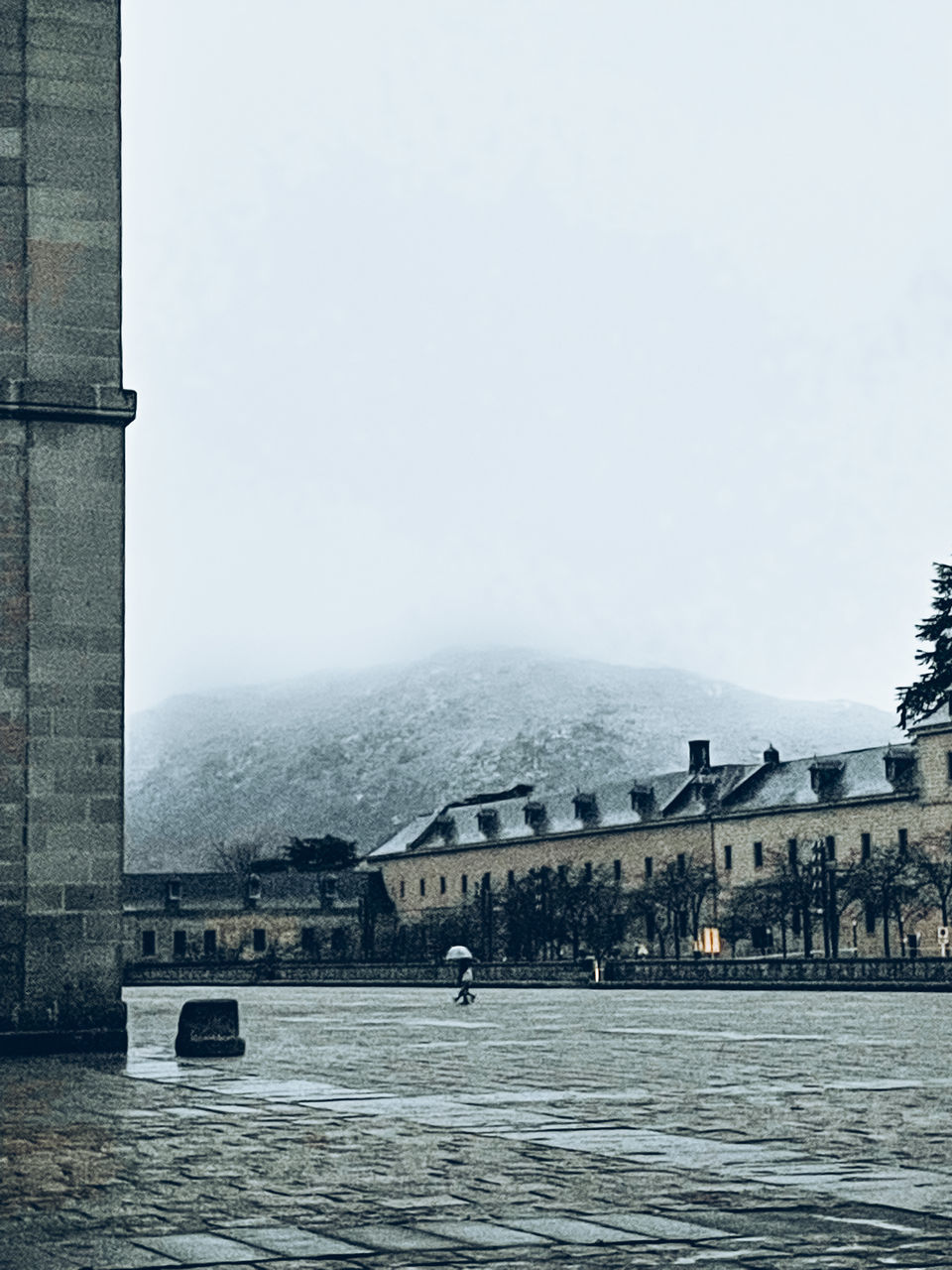 BUILDINGS BY SEA AGAINST SKY IN WINTER