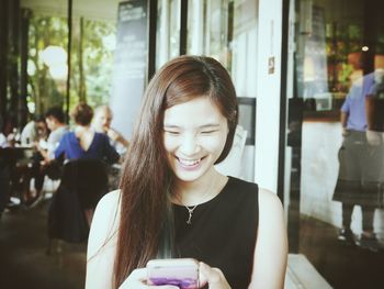Young woman using smart phone