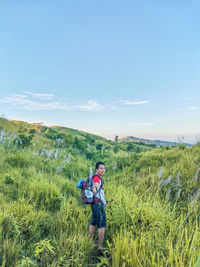 Full length of man on grass against sky