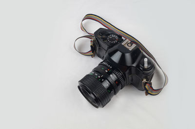 High angle view of camera against white background