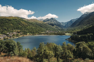 Scenic view of lake and mountains against sky