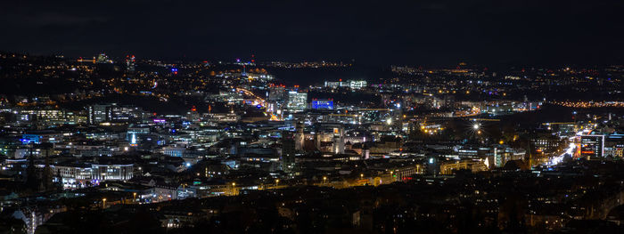 High angle view of illuminated city buildings at night