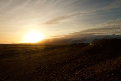 Scenic view of landscape against sky during sunset