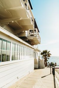 View of building by sea against sky