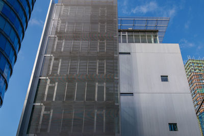 Low angle view of modern buildings against sky