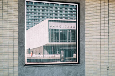 Reflection of building on glass window