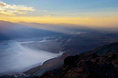 Scenic view of mountains against sky during sunset