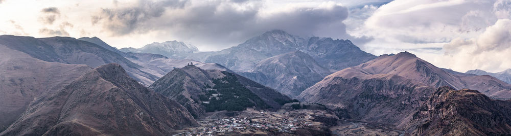 Panoramic view of mountains against sky