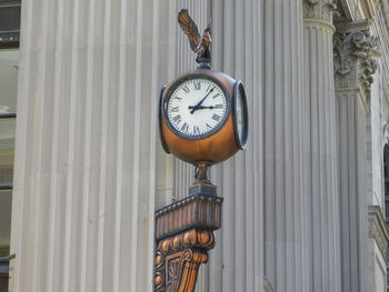 Close-up of clock on wall