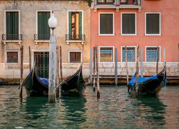 Boats moored in canal