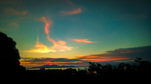 Scenic view of silhouette trees against sky during sunset