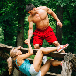 Young couple kissing on tree