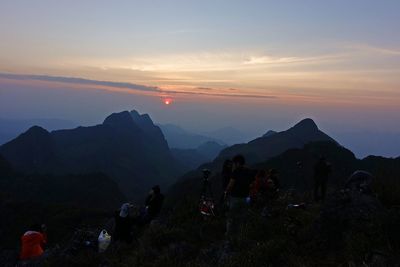 Scenic view of mountains against sky at sunset