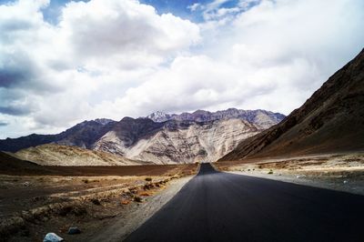 Road amidst landscape against sky