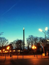 Low angle view of illuminated street light at night