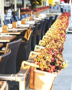 High angle view of potted plants by tables and chairs at restaurant