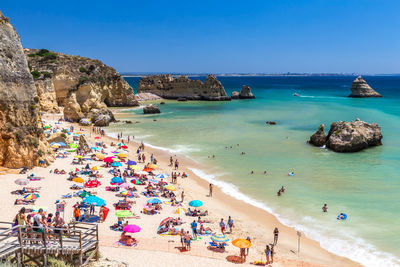 High angle view of people on beach against sky