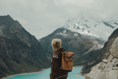 Rear view of woman looking at mountains