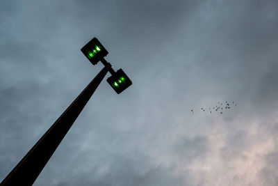 Low angle view of street light against sky