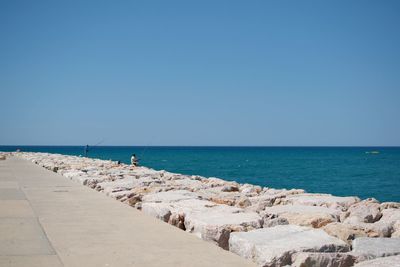 Scenic view of sea against clear blue sky