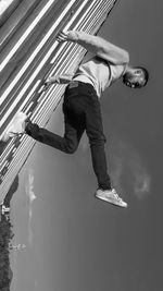 Low angle view of man jumping outdoors