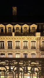 Buildings in city at night