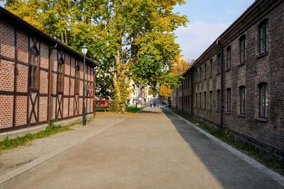 Street amidst buildings against sky