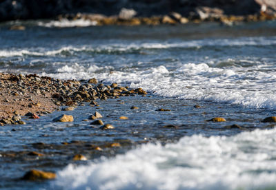 Close-up of water splashing in sea