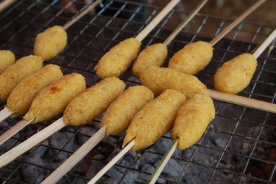 High angle view of meat on barbecue grill