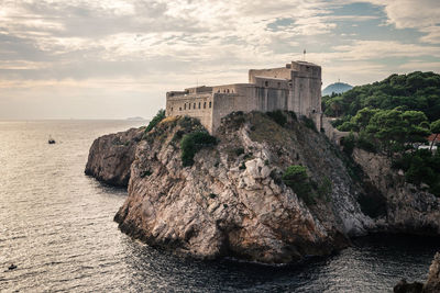 Scenic view of sea against cloudy sky