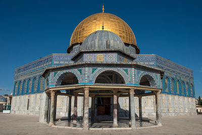 Exterior of temple mount against clear blue sky