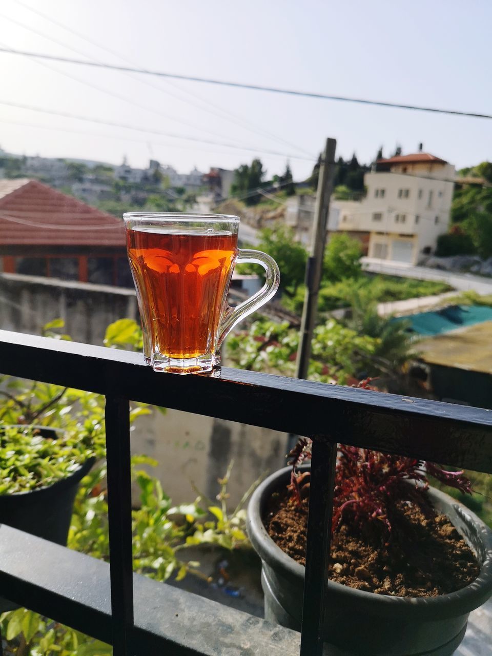 CLOSE-UP OF DRINK ON TABLE AGAINST WALL