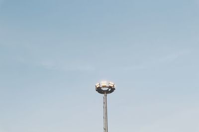 Low angle view of illuminated street light against sky