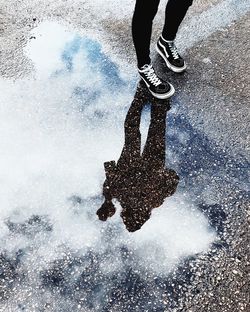 Low section of person in puddle