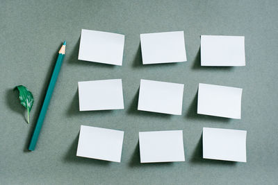 Directly above shot of blank papers on blue background