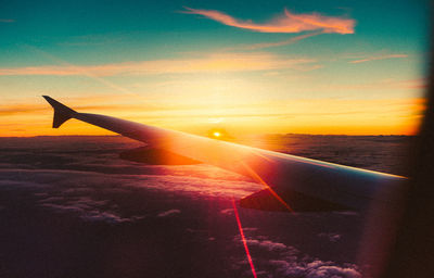 Cropped image of airplane flying in sky