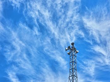 Low angle view of electricity pylon against sky