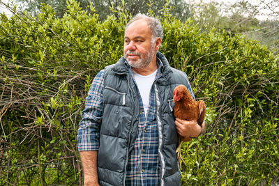 Man holding hen