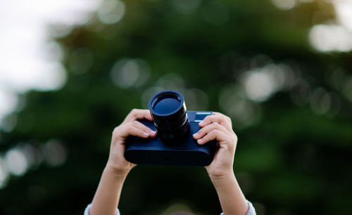 Midsection of woman using mobile phone