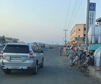 Vehicles on road along buildings