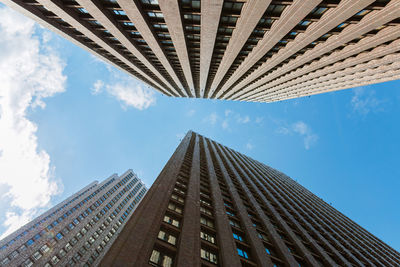 Low angle view of modern buildings against sky