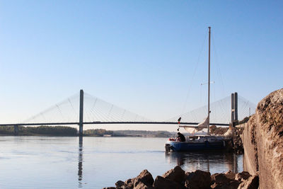 Bridge over river against clear sky