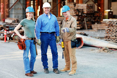 Group of construction workers looking at camera on construction site