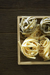 Tagliatelle in box on table