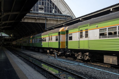 Train at railroad station against sky