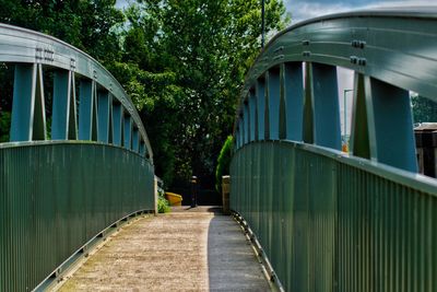 Footbridge over the river amidst trees